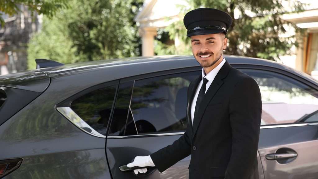Driver opening door for client, Travel Companies service.